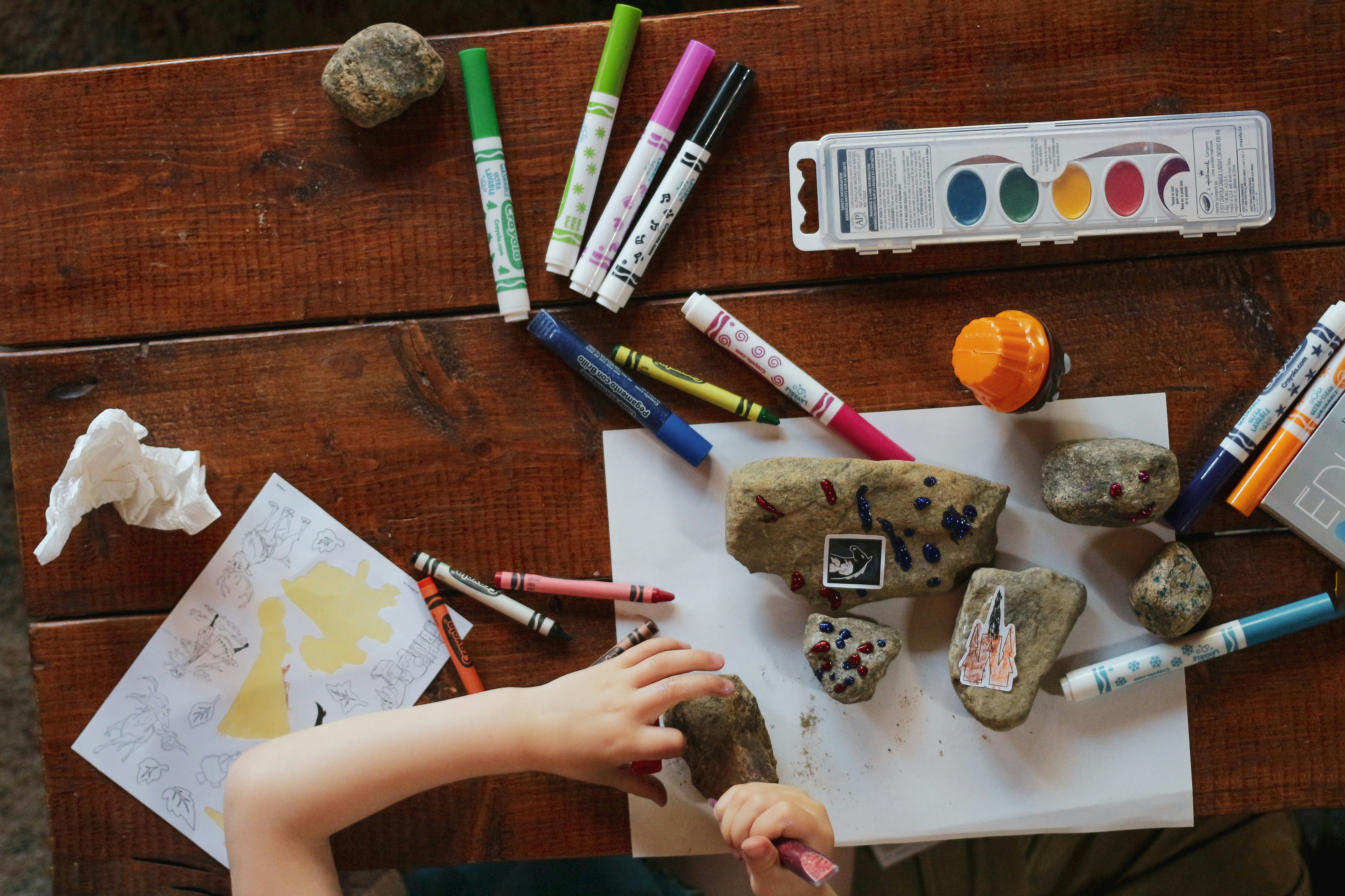 Children engaged in hands-on outdoor learning at The Backyard School preschool in Mesa, Arizona
