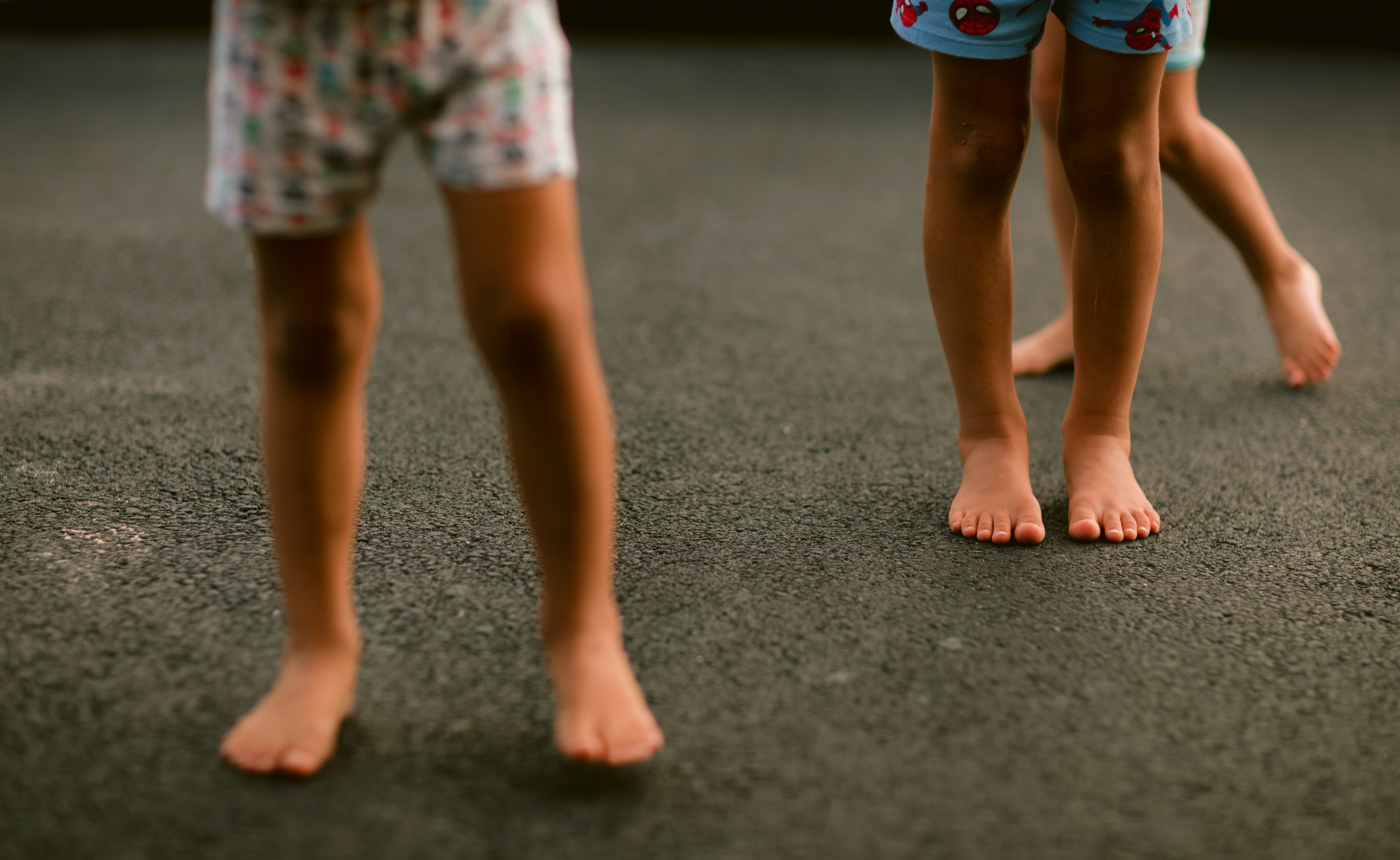 Children exploring and playing outdoors at The Backyard School preschool